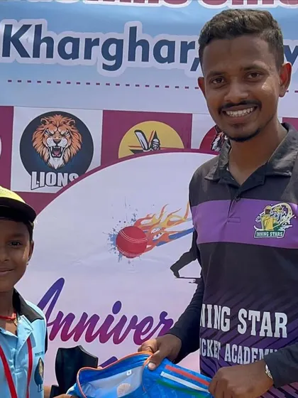 A young player receives an award from the coach during our Anniversary Match Day, a special event for the entire academy.