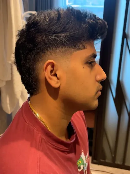 Another angle of Yash Thakur's mullet.