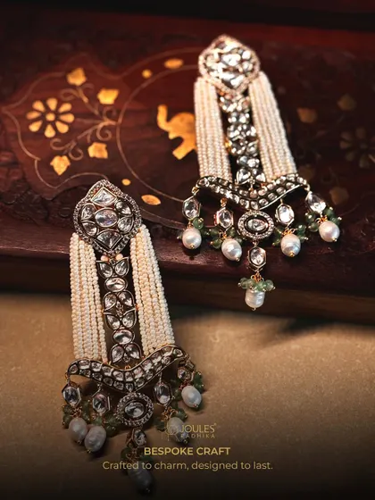 Crafted to charm, designed to last. These magnificent earrings feature a cascade of pearls and polki diamonds, perfect for a bride.