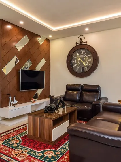 A duplicate of ID 77, this image showcases the classic living room with its leather sofas and custom wood-panelled TV wall.
