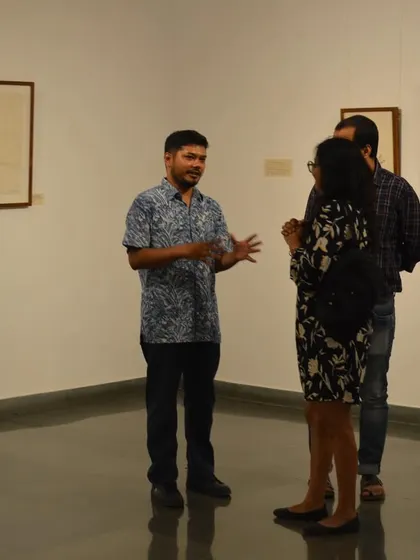 Artist Mohit Mahato in conversation with visitors during his exhibition preview. I encourage artists to be present and share the stories behind their work directly with the audience.