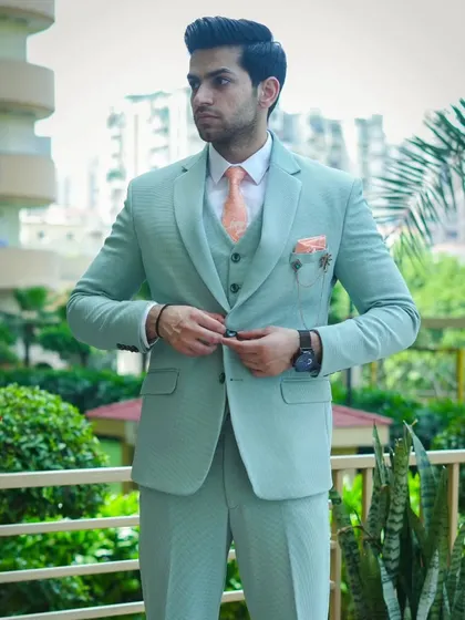 This light mint green three-piece suit is perfect for a summer wedding or a day event. The color is fresh and modern, and the fit is tailored to perfection.