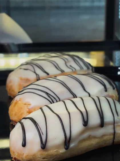 Chocolate-striped glazed pastries line our counter tray, showing the finish on each individual bake.