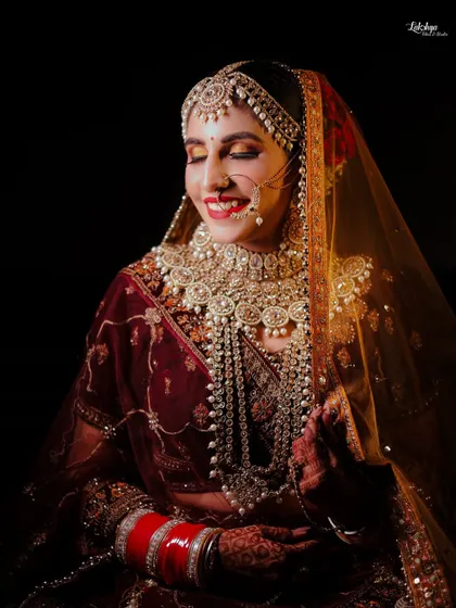 The pure joy of a bride on her wedding day. This candid shot captures a beautiful, natural smile, showing her happiness and radiance in her full bridal attire.