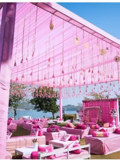 This lakeside event shows my ability to work with a monochromatic color scheme. The shades of pink in the canopy, seating, and floral details create a soft, romantic, and modern look for a daytime function.
