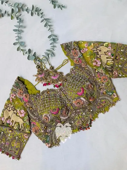 Another view of the mustard blouse, a fine display of Indian couture craftsmanship.