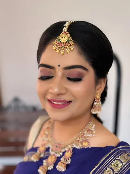 A beautiful smile from a radiant bride. This look features a soft pink smokey eye that perfectly matches her jewellery and a flawless matte base. It's a wonderful example of how traditional makeup can also feel modern and fresh.