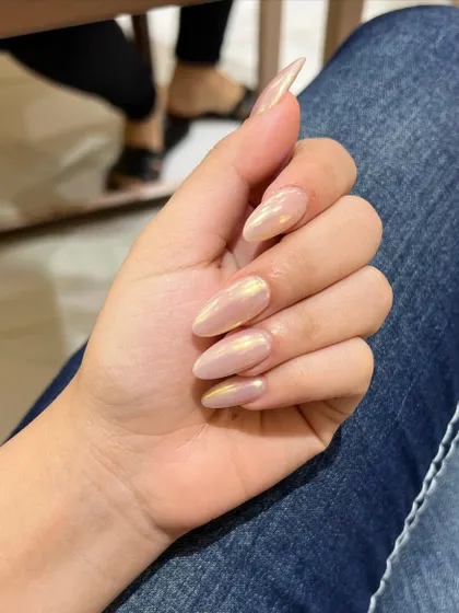 The way the light catches this iridescent polish is just beautiful. It's a simple way to make your nails look extra special.