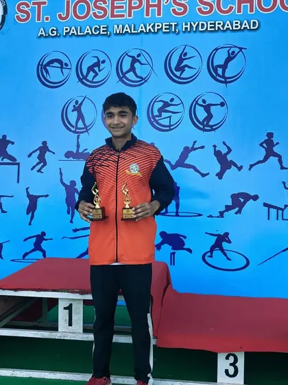 Yuv holding his trophies from the CISE National Games, a proud moment for him and his coaches.