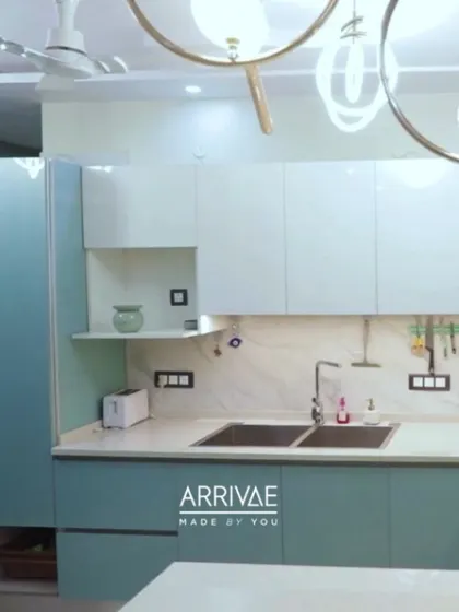 A fresh and modern kitchen with pastel blue and white cabinets. The design is bright, airy, and perfect for those who love a pop of color.