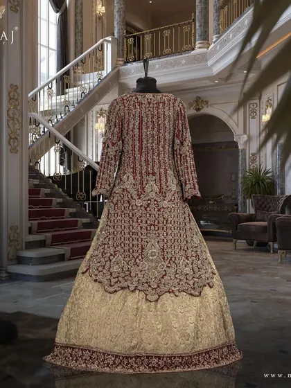 The back view of the maroon scalloped long top and gold banarsi lehenga, highlighting the intricate hand embroidery.