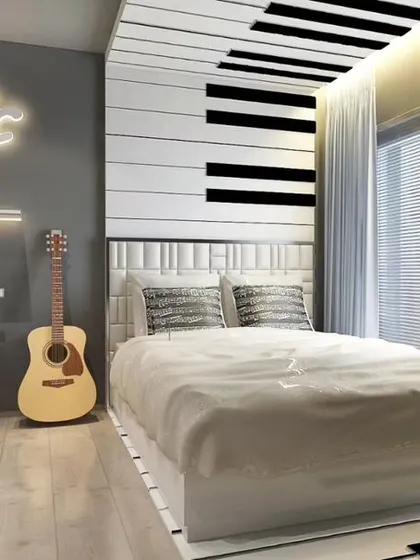 A full view of the music-themed bedroom, showcasing the piano-inspired wall, the integrated study desk, and the overall modern, monochromatic design.