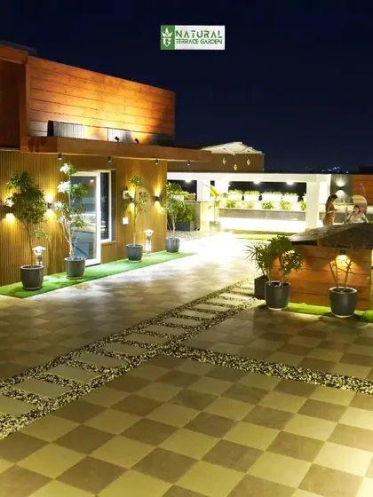 A night view looking across the entire Palam Vihar terrace, showcasing the scale of the project and the comprehensive lighting scheme.