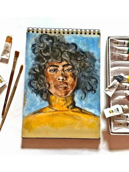 The full view of the gouache portrait, displayed with my paint set and brushes to give context to the creative process.
