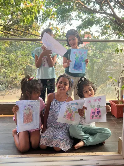 Magical smiles and beautiful flower vase drawings. This was a perfect summer art activity, full of color and sunshine.