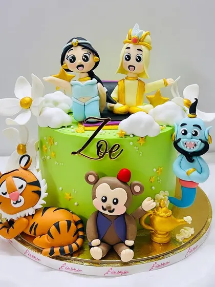 A whole new world on a cake. This Aladdin-themed cake features Jasmine, Aladdin, Genie, Abu, and Rajah, all handcrafted in fondant for a magical birthday.