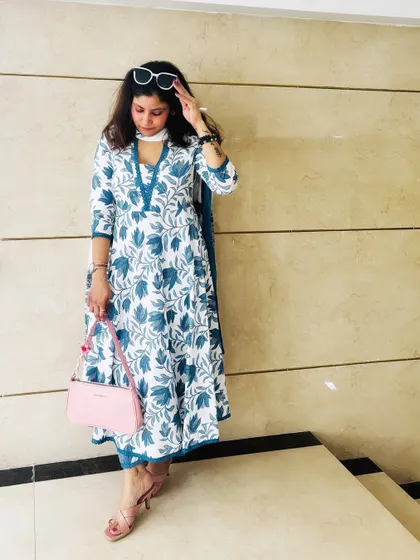 Modern desi style is all about comfort and elegance. This blue and white floral cotton kurta set is perfect for a sunny day out, combining traditional prints with a contemporary silhouette for a look that's effortlessly graceful.