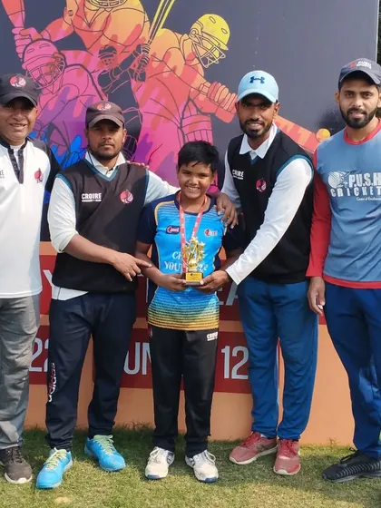 The coaching staff with one of the standout performers. We work closely with our players to guide them during tournaments.