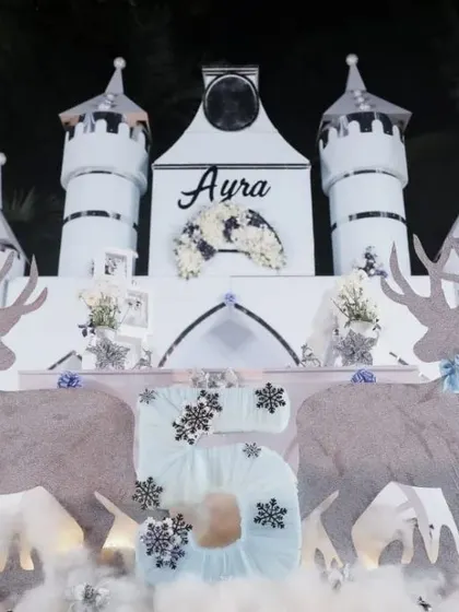 A magical Winter Wonderland created for our little princess Ayra's 5th birthday. The decor features a grand ice castle backdrop, majestic reindeer cutouts, and sparkling snowflakes, turning a birthday party into an enchanting winter dream.