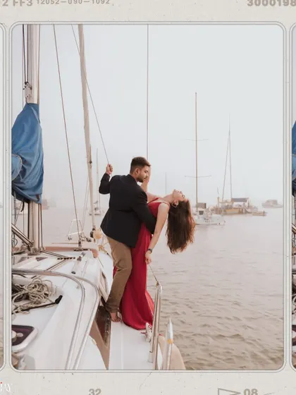A dynamic, dancing pose on a yacht, with the woman's red dress creating a beautiful contrast against the sea.