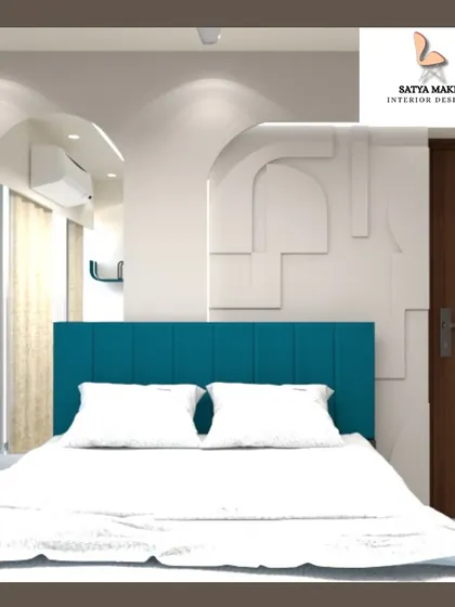 A minimalist bedroom design featuring a clean white wardrobe with an arched detail, complementing the teal headboard.