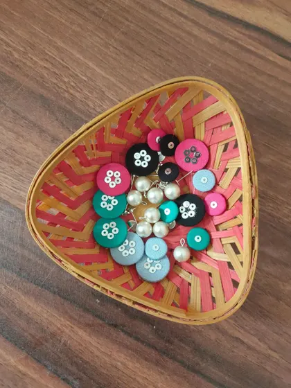 A glimpse of my work-in-progress materials. You can see colorful fabric components, beads, threads, and hand-painted pieces all waiting to be turned into beautiful jewelry.