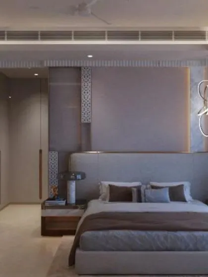 A contemporary bedroom design with a unique, swirling LED wall light feature and a sophisticated grey color scheme.