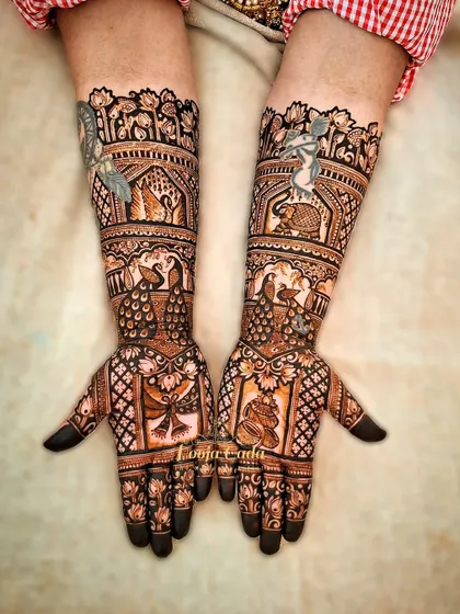 A beautiful design for an NRI bride from the US, featuring traditional motifs like elephants and swans with a unique twist.