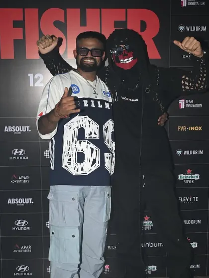 Posing with Almost Human at a press wall for a Fisher event. Our collaboration extends beyond the decks, representing a strong partnership in the industry.