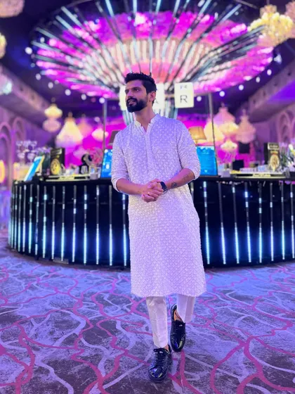 Keeping it classic and elegant in a white chikankari kurta. This look is ideal for a daytime wedding ceremony or a festive celebration.