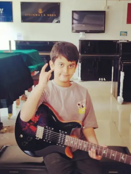 A proud moment for our little rockstar, getting his first electric guitar. We help guide students and parents in choosing the right instrument for their journey.