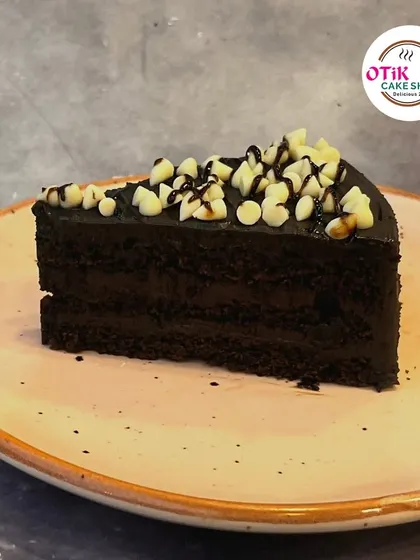 Our Choco Chip Pastry is a delightful treat. The rich chocolate cake is topped with a smooth ganache and a generous sprinkle of white chocolate chips for added texture and sweetness.