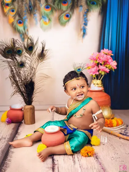 Caught in the act. This little Krishna has a bit of butter on his face, adding a fun and authentic touch to the themed shoot.