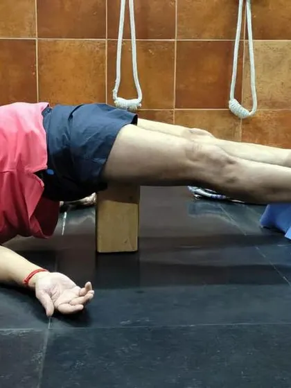 A restorative pose with a chair and block.