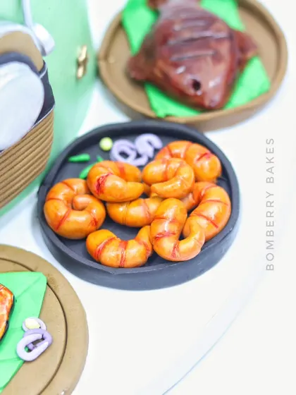 A detailed shot of the incredibly realistic-looking fried prawns, all made from fondant.
