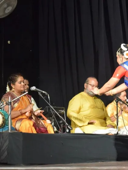 Conducting the nattuvangam for my student's performance. The live orchestra is an integral part of a traditional Bharatanatyam recital.
