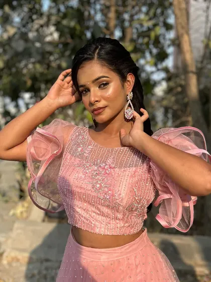 A duplicate of image 158, a happy and confident pose, showing how the makeup enhances her natural features and gives her a photo-ready look.