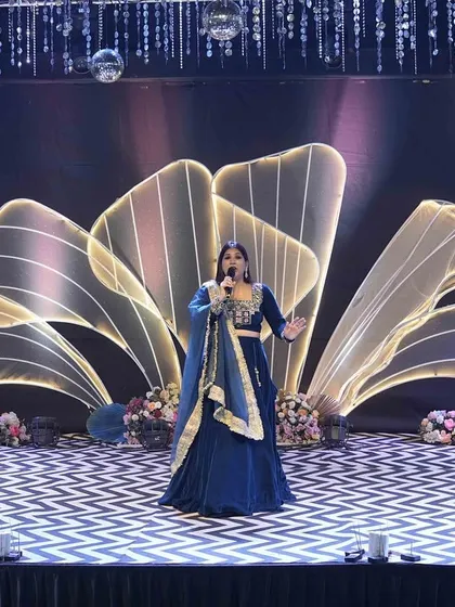 Commanding the stage during a sangeet performance. The grand stage design and lighting added to the magical atmosphere of the night.