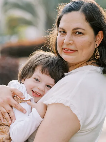 A mother and her son sharing a hug. The genuine emotion in this photo is what makes it so special.