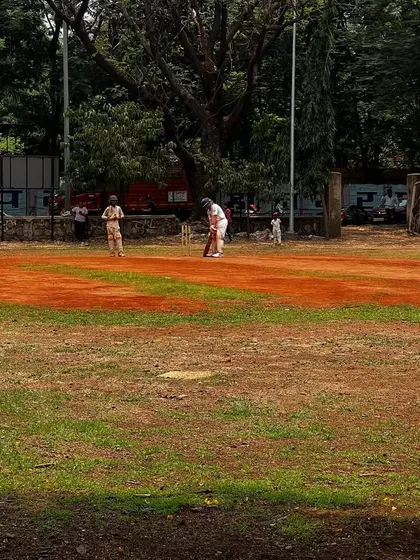A wide view of a tournament match in progress. Players are positioned strategically, learning about field placements and game awareness in a live setting.