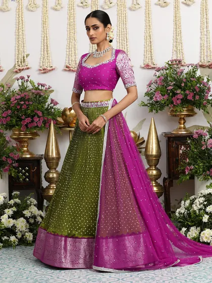 The full view of the olive green and magenta lehenga, a luxurious trousseau piece that blends tradition with contemporary style.