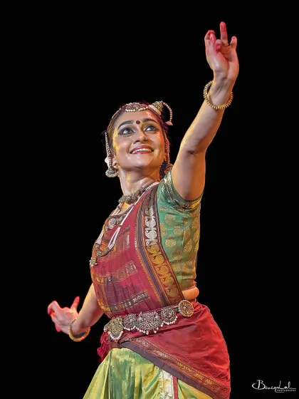 A graceful gesture, filled with meaning and emotion, from a live performance.