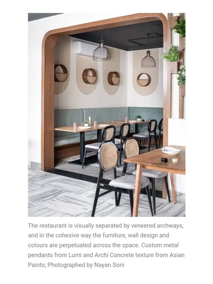 I use architectural elements like this veneered archway to visually separate dining zones while maintaining an open feel. It frames the view into the next space, creating layers and depth within the restaurant.