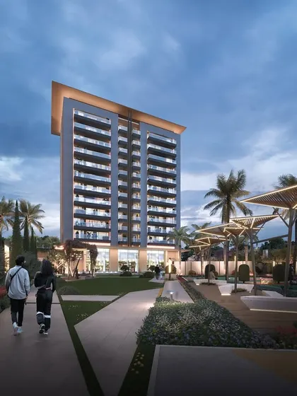 A twilight render of Gulnaar Zenium, showcasing the thoughtful lighting design that enhances the modern architecture and landscaped gardens in the evening.