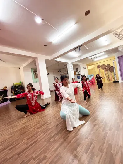 A dynamic moment captured during our semi classical class, with dancers in various expressive poses across the studio floor.