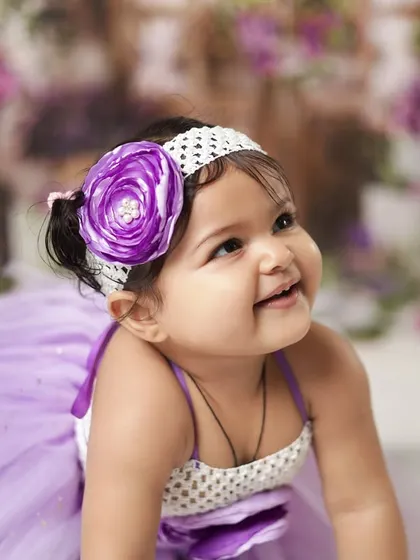 A happy, upward glance from a crawling baby. We capture them on the move too, showing their energy and playful spirit.