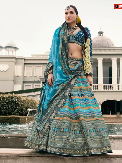 Step into a world of beauty with this fabulous blue multi-tonal lehenga, a perfect rental to make a statement.