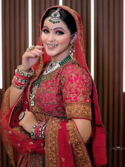 A charming portrait of the bride smiling. Her pose is natural and engaging, showcasing her joy on the special day.