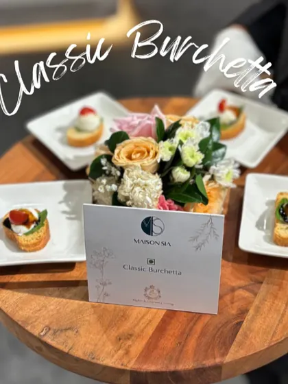 Classic Bruschetta presented with a floral touch. I top toasted bread with fresh ingredients, offering a simple yet elegant taste of Italy.