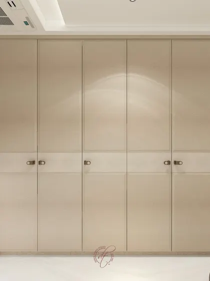 A close-up detail of the minimalist wardrobe design, showcasing the clean lines and high-quality finish we aim for in our projects.